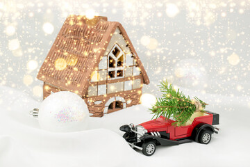 A Christmas card or poster. Red car, snow, gifts, glitter. Blurred fabulous bokeh background