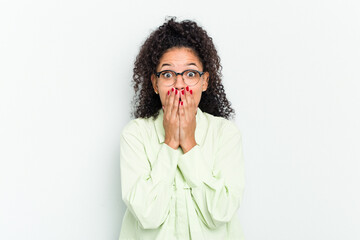 Young african american woman isolated shocked, covering mouth with hands, anxious to discover something new.