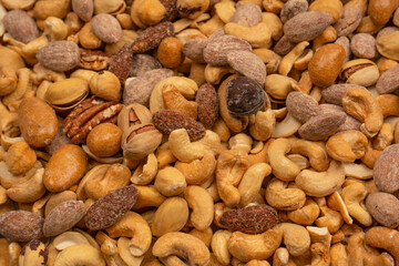 A group of almonds, pistachios, walnuts, macadamia, cashews.