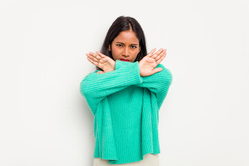 Young Indian woman isolated on white background doing a denial gesture