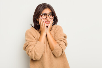 Young Indian woman isolated on white background scared and afraid.