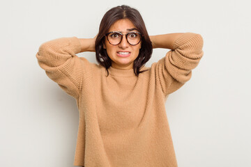 Young Indian woman isolated on white background screaming with rage.