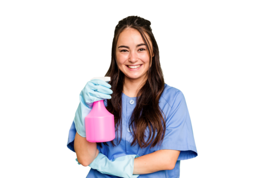 Young cleaner caucasian woman isolated on green chroma background laughing and having fun.