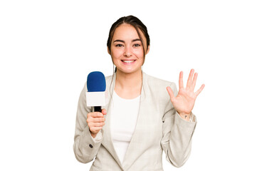 Young TV presenter caucasian woman isolated on green chroma background smiling cheerful showing number five with fingers.