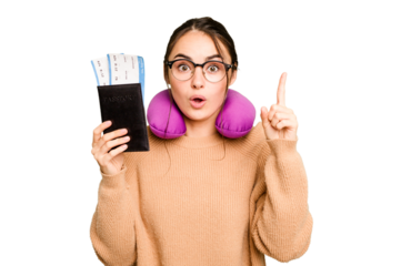 Young caucasian woman with inflatable travel pillow holding passport isolated on green chroma background having an idea, inspiration concept.