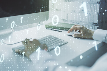 Double exposure of creative abstract binary code hologram and hands typing on laptop on background. Database and programming concept