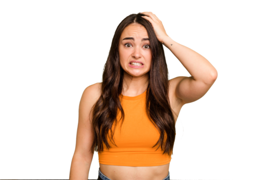 Young caucasian woman isolated on green chroma background being shocked, she has remembered important meeting.