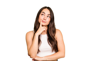 Fototapeta premium Young caucasian woman isolated on green chroma background contemplating, planning a strategy, thinking about the way of a business.