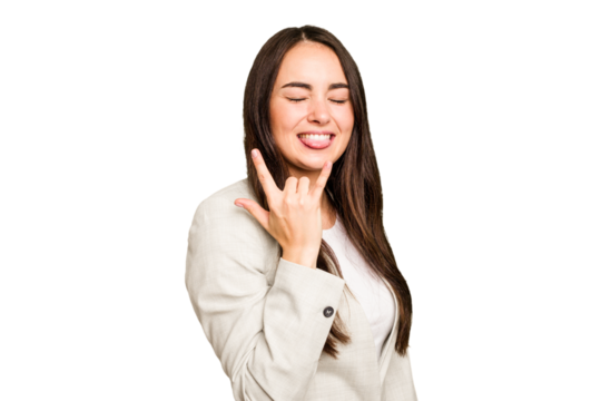 Young caucasian woman isolated on green chroma background showing rock gesture with fingers