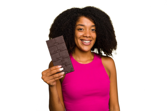 Young African American woman holding a chocolate bar isolated happy, smiling and cheerful.