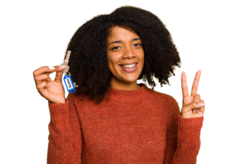 Young African american woman holding home keys isolated showing number two with fingers.