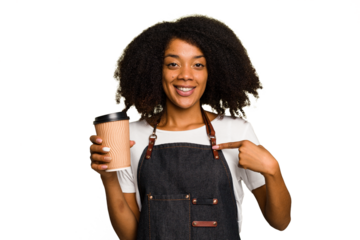 Young african american woman barista holding a takeaway coffee person pointing by hand to a shirt copy space, proud and confident