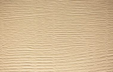 Brown background from decorative plaster with abstract spots. Unusual beige wall texture with beautiful patterns, creative surface background. Front covering for facing of buildings.