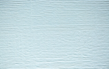 Light background of decorative plaster with abstract spots. Unusual texture of white or gray wall with beautiful patterns, creative surface background. Finishing coating for building cladding.