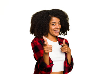 Young African American woman isolated pointing to front with fingers.