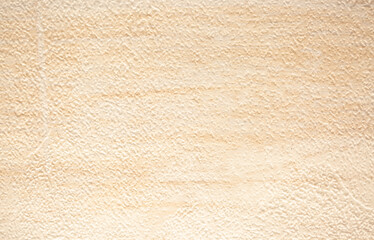 Fototapeta na wymiar Brown background from decorative plaster with abstract spots. Unusual beige wall texture with beautiful patterns, creative surface background. Front covering for facing of buildings.