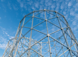 Industrial architecture steel silo metallic skeleton against sky