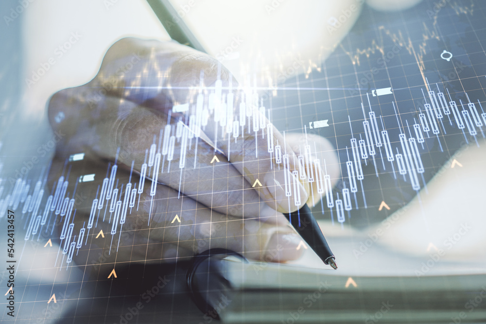 Aufkleber abstract creative financial graph with world map and with woman hand writing in notebook on backgrou