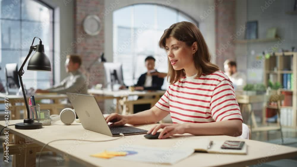 Leinwandbilder portrait of caucasian young inspired woman smiling and working on laptop in busy office. analyst gat