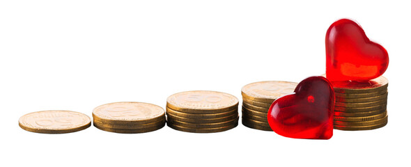 Close-up of red hearts with golden coins on background
