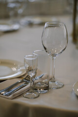 Glasses with champagne are on the table, table setting in a restaurant for a banquet