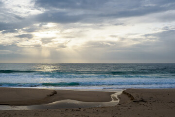 Fototapeta na wymiar Cloudy sky on Mollymook beach, near Uladulla, Australia