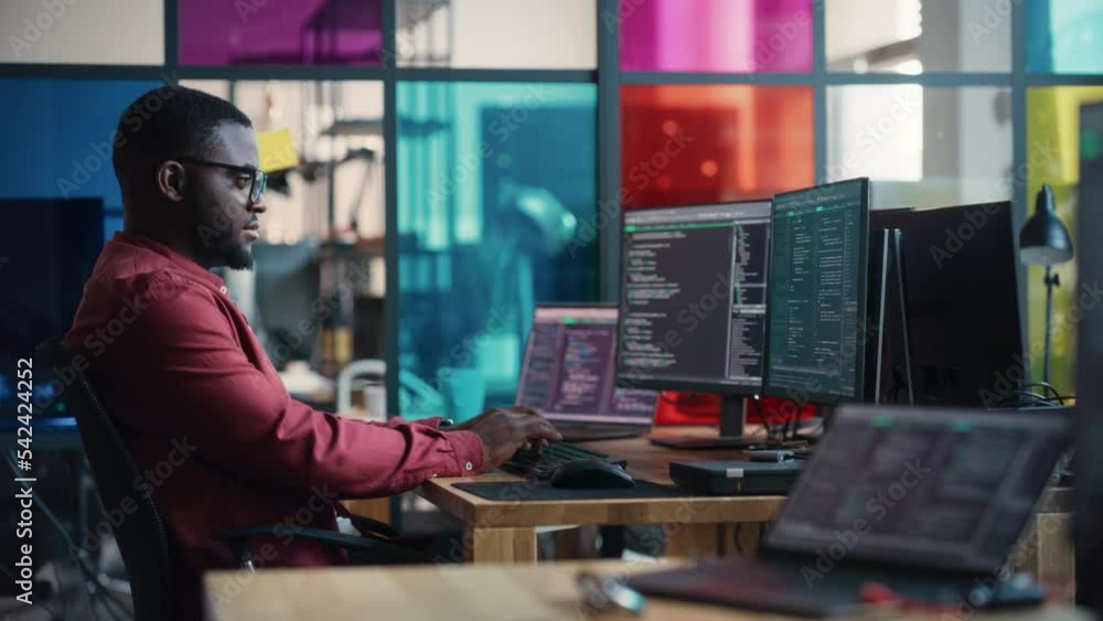 Poster Male Senior Software Developer Writing Code On Desktop Computer With Two Displays Setup in Stylish Office. Black Man Working On Mobile Application For Online Service of Modern Start-up Company.