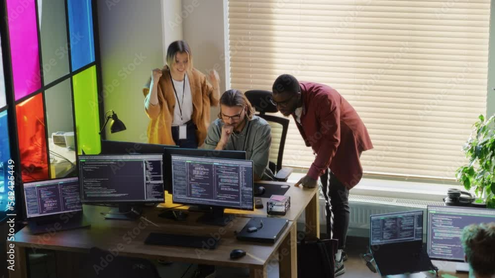 Poster Diverse Developers Looking at Desktop Computer Monitor in Creative Office. Black Man and Caucasian Woman Helped Software Engineer Team Member to Fix a Bug. Successful Programmers High Five Each Other