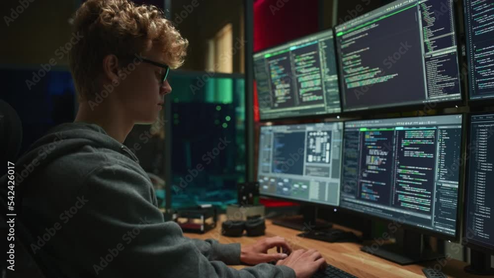 Poster Male Cyber Security Intern Writing Code on Desktop PC With Professional Six Monitors Setup in the Office. Young Caucasian Man Monitors Digital Protection System For an Data Company