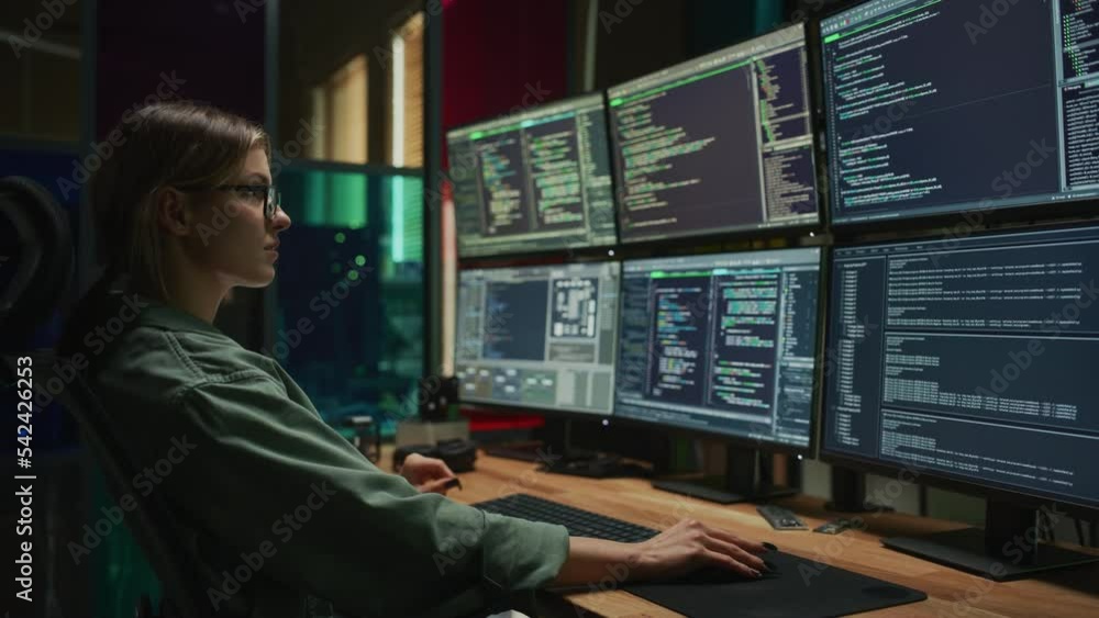 Poster Female Cyber Security Specialist Writing Code On Deskop Computer with Six Displays in Dark Office. Caucasian Woman Controlls Digital Protection System, Monitoring Data, Debugging Software Errors.