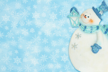 Snowman with snowflakes winter background