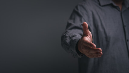 Business people in office suits standing and shaking hands, close-up. Business cooperate teamwork and communication concept. Handshake and marketing. Need help concept.