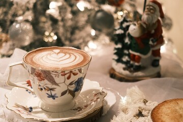 Cup of coffee among the Christmas decorations