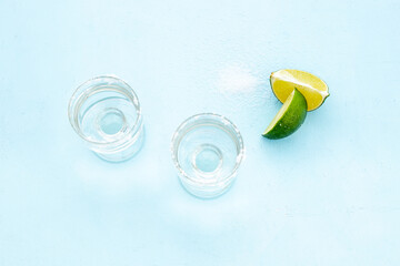 Strong alcohol background - glasses of tequila with salt