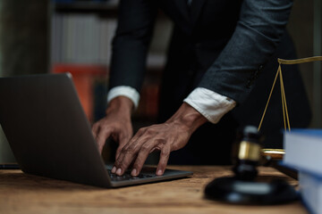 Fototapeta na wymiar Close up lawyer businessman working with laptop in office workplace for consultant lawyer concept. Law, legal services, advice, Justice concept