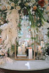 romantic wedding decoration. Outdoors with clear tent. Modern wedding ceremony or reception for family and friends dinner. Intimacy event. orange Soft colors flowers
