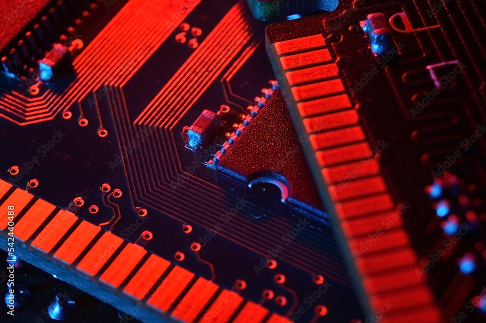 Wall mural computer cpu processor chip on circuit board ,motherboard background. close-up. with red-blue lighti