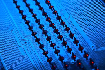 Fototapeta premium Computer cpu processor chip on circuit board ,motherboard background. Close-up. With red-blue lighting