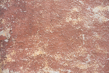 Brown peeled paint on old wall close up