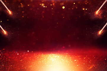 background of abstract red, gold and black glitter lights. defocused