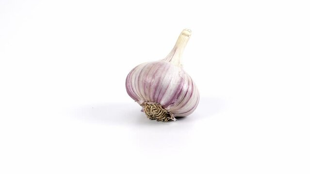 spining garlic on the white background, garlic on the white , close-up of garlic, garlic rotating on a white background