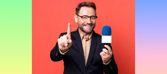 middle age man smiling proudly and confidently making number one. journalist and a microphone...