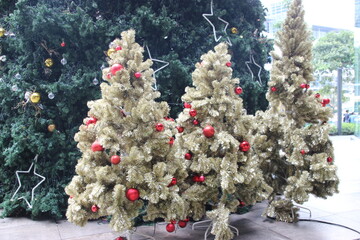 white charismas tree with golden and other decoration 