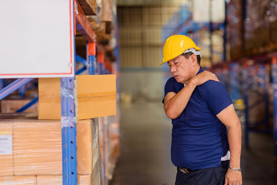warehouse worker back shoulder muscle pain injuries from heavy lifting hard working.