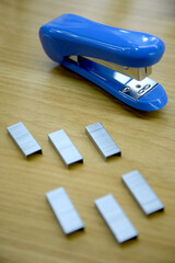 stapler with staples - obrazy, fototapety, plakaty