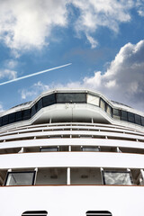 Cruise ship navigational bridge deck on modern boat with beautiful sky behind.