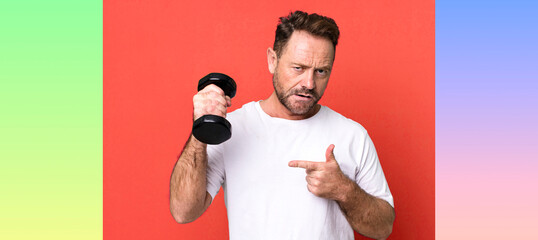 middle age man with a dumbbell. fitness concept