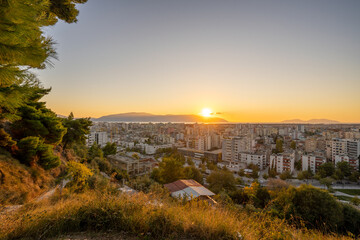 Attractive spring cityscape of Vlore city from Kuzum Baba. Captivating sunset sescape of Adriatic sea. Spectacular outdoor scene of Albania, Europe. Traveling concept background.