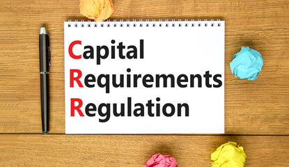 CRR capital requirements regulation symbol. Concept words CRR capital requirements regulation on white note on a wooden background. Business CRR capital requirements regulation concept. Copy space.
