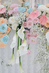 Romantic wedding party with stage on pool area. pale Blue white pink purple flowers accent. Modern wedding decoration, table settings outdoors for intimacy wedding dinner with family and friends on to